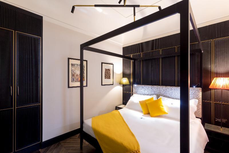 Hotel The Haven Roma Exterior foto A bedroom at the hotel